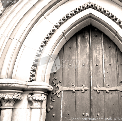 Image of brown wooden parliament in london old  door and marble antique  