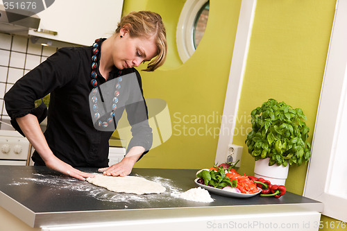 Image of Woman Making Pizza