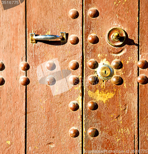Image of rusty  brown    morocco in africa the old wood  facade home and 