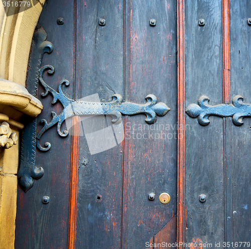 Image of brown wooden parliament in london old  door and marble antique  