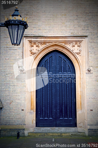 Image of brown wooden parliament in london old  door and marble antique  