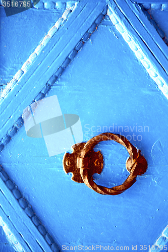 Image of blue metal rusty  brown    morocco in africa   padlock 