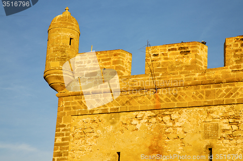 Image of  brick in old construction  africa morocco and   the tower near 