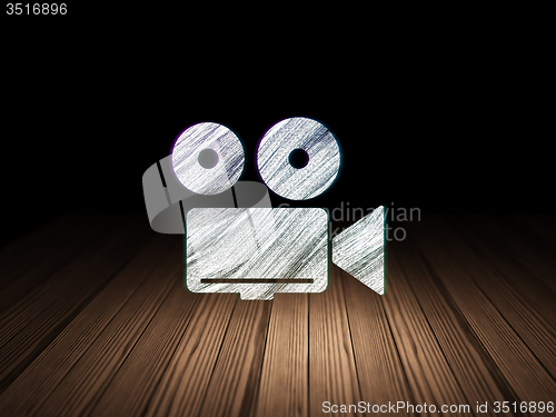 Image of Travel concept: Camera in grunge dark room