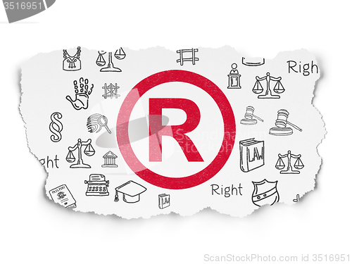 Image of Law concept: Registered on Torn Paper background