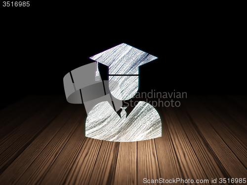 Image of Education concept: Student in grunge dark room