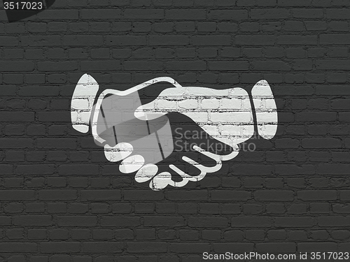 Image of Political concept: Handshake on wall background