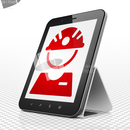 Image of Industry concept: Tablet Computer with Factory Worker on display