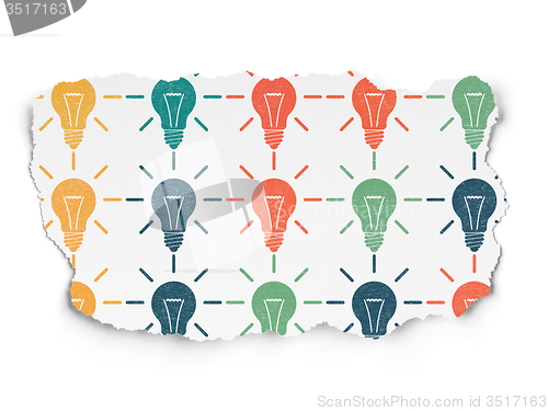 Image of Finance concept: Light Bulb icons on Torn Paper background