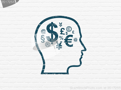 Image of Finance concept: Head With Finance Symbol on wall background