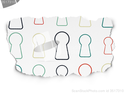 Image of Security concept: Keyhole icons on Torn Paper background