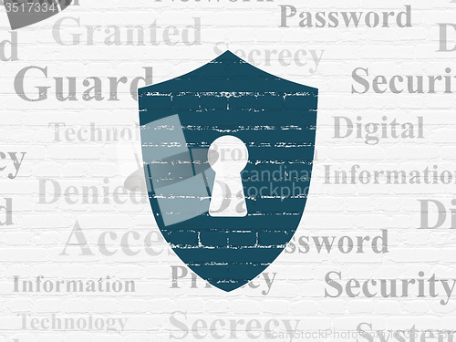 Image of Security concept: Shield With Keyhole on wall background