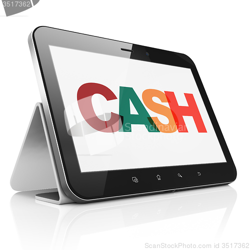 Image of Currency concept: Tablet Computer with Cash on  display