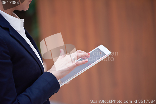 Image of business woman working on tablet