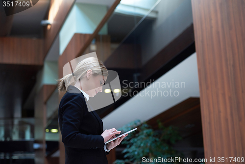 Image of business woman working on tablet