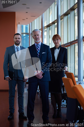 Image of senior business man with his team at office