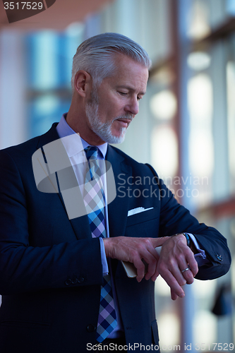 Image of senior business man talk on mobile phone