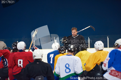 Image of ice hockey players team meeting with trainer