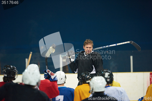 Image of ice hockey players team meeting with trainer