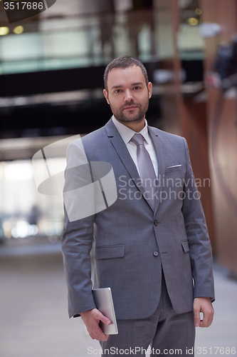 Image of business man with tablet