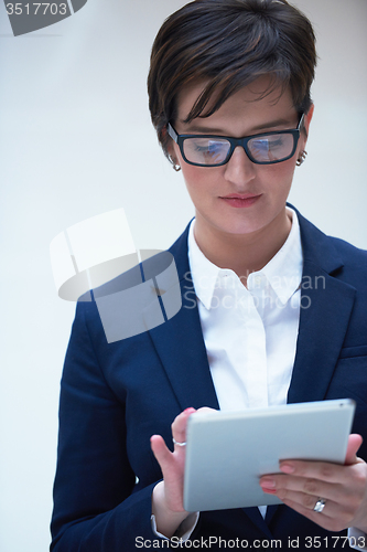 Image of business woman working on tablet