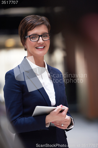 Image of business woman working on tablet