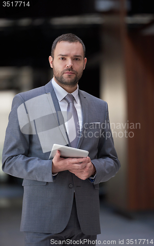 Image of business man with tablet