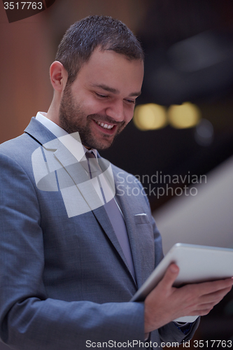 Image of business man with tablet