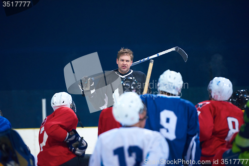 Image of ice hockey players team meeting with trainer