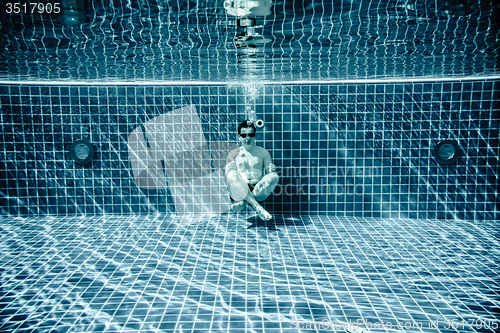 Image of Persons lies under water in a swimming pool