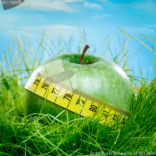 Image of apple and measuring tape