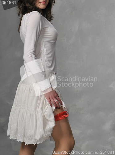 Image of White dressed girl and red garter