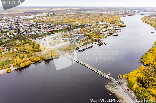Image of Pontoon bridge over Tura river. Tyumen. Russia