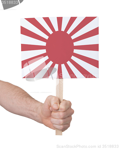 Image of Hand holding small card - Flag of Japan