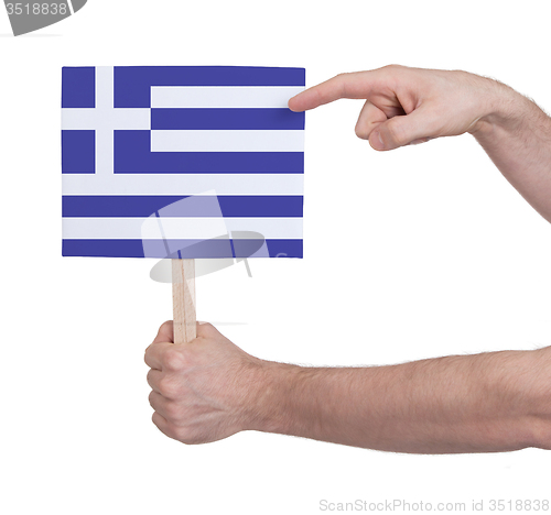 Image of Hand holding small card - Flag of Greece