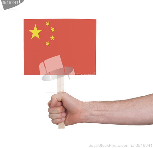 Image of Hand holding small card - Flag of China