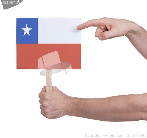 Image of Hand holding small card - Flag of Chile