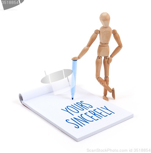 Image of Wooden mannequin writing - Yours sincerely