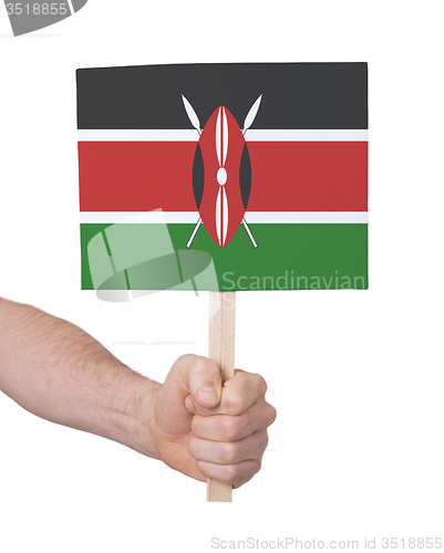 Image of Hand holding small card - Flag of Kenya