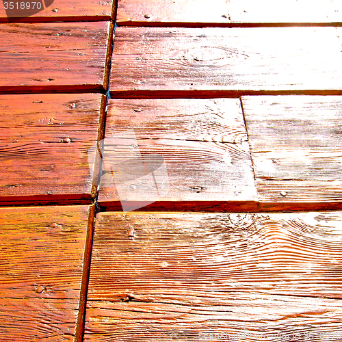 Image of grain texture of a brown antique wooden old door in italy   euro