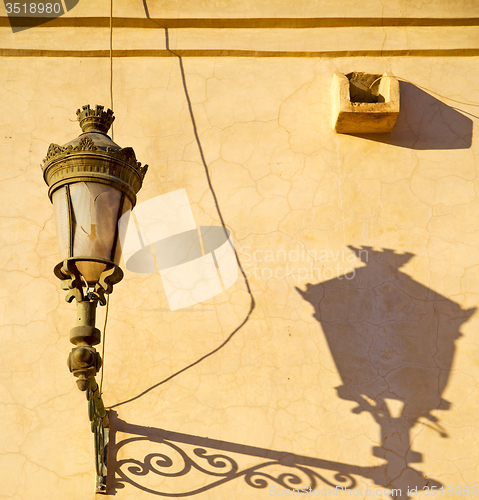 Image of  street lamp in morocco shadow and decoration