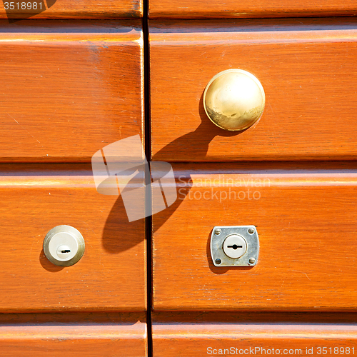 Image of stripped paint  door    in italy   ancian wood and traditional  