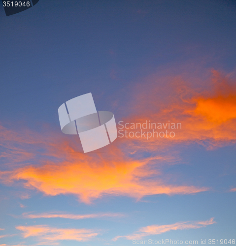 Image of the sunrise in  colored sky white soft clouds and abstract backg