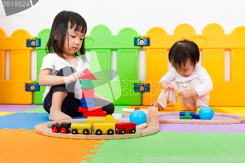 Image of Asian Chinese childrens playing with blocks