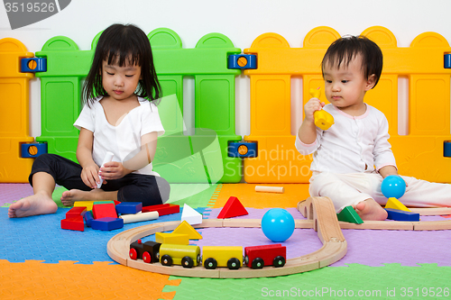 Image of Asian Chinese childrens playing with blocks