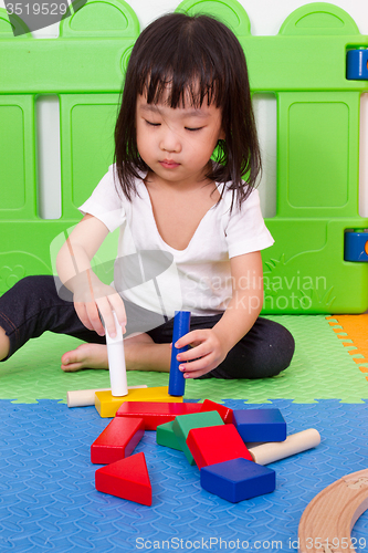 Image of Asian Chinese children playing with blocks