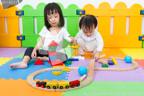 Image of Asian Chinese childrens playing with blocks