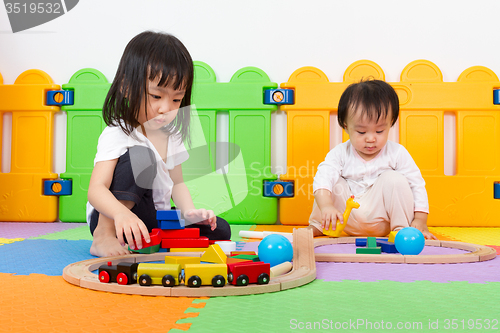 Image of Asian Chinese childrens playing with blocks