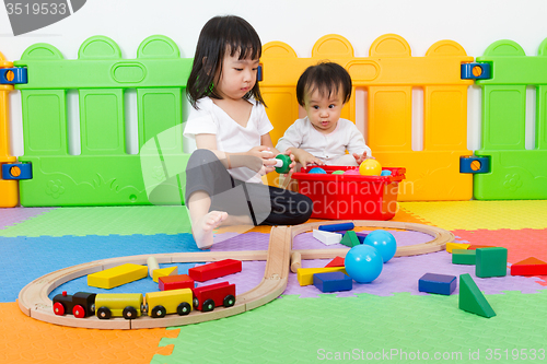 Image of Asian Chinese childrens playing with blocks