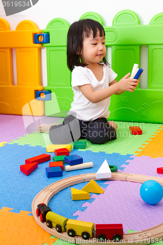 Image of Asian Chinese children playing with blocks